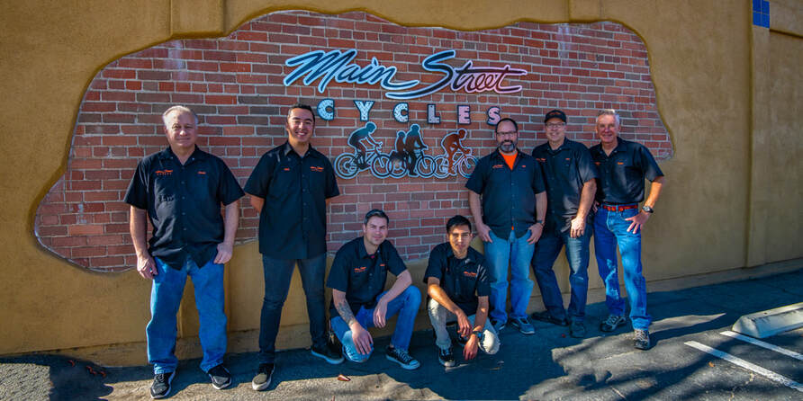 Main stree crew in front of their store